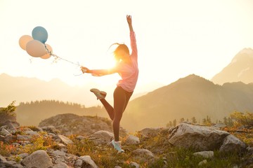 Girl dancing on Artist Poin at sunrise, Mt. Baker