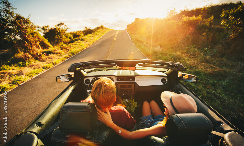 Wall mural Happy Couple Driving in Convertible