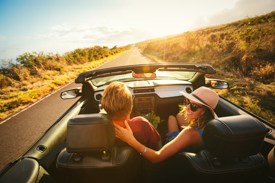 Fototapeta Happy Couple Driving in Convertible
