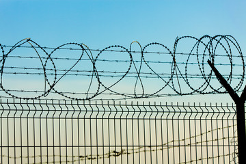 Metal Fence with Barbed Wire