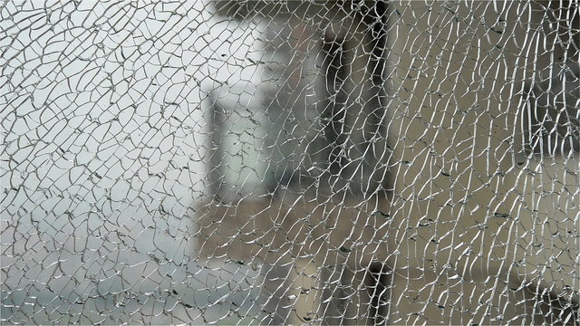 zooming in through a broken window