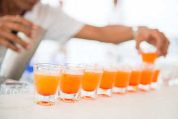 fresh orange juice in shot glasses © Sunanta