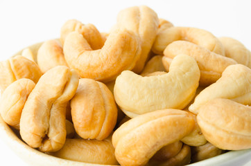 Close up cashew nuts with salt.