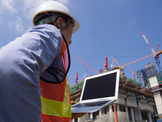 Construction worker using pc