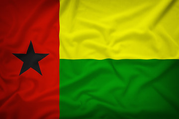 Guinea Bissau flag on the fabric texture background,Vintage styl