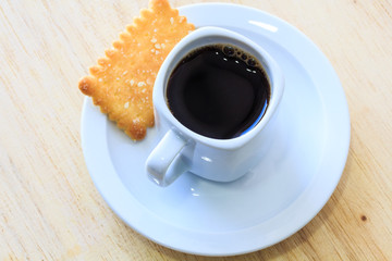 Coffee with Cookies on Wooden Table.