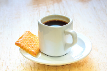 Coffee with Cookies on Wooden Table.