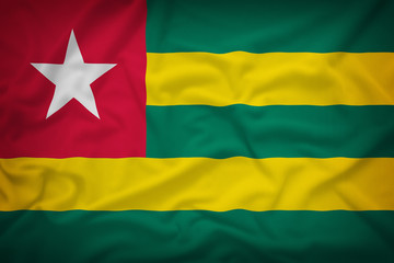 Togo flag on the fabric texture background,Vintage style