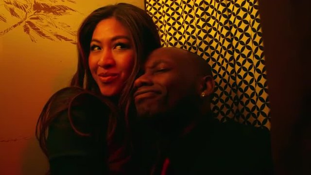 A couple making faces in a photo booth