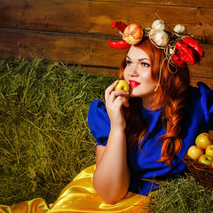 Girl holds a ripe apple.