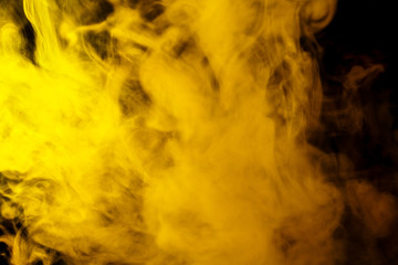 Abstract yellow smoke hookah on a black background.