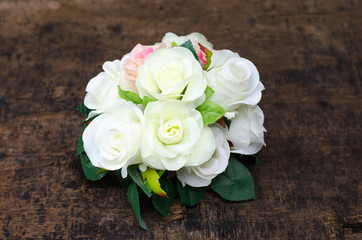 Beautiful pink and white roses isolated on wood