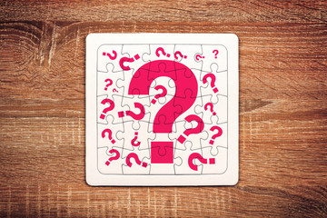 Question marks on jigsaw puzzle