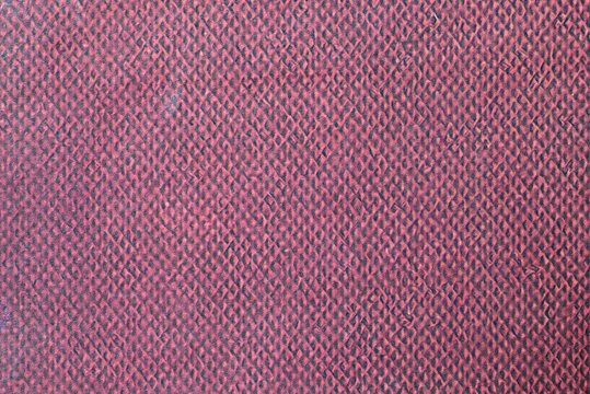 Red and black plastic pattern texture.