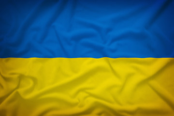 Ukraine flag on the fabric texture background,Vintage style