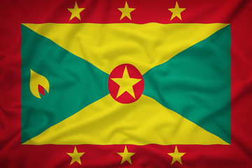 Grenada flag on the fabric texture background,Vintage style