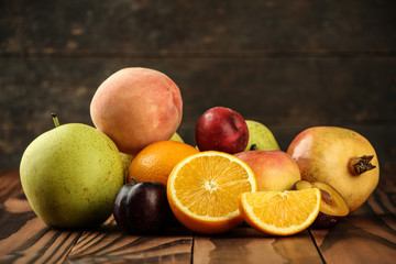Assortment of exotic fruits on the wooden table