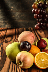 Naklejka na ściany i meble Assortment of exotic fruits on the wooden table