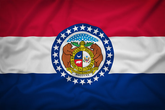 Missouri flag on the fabric texture background,Vintage style