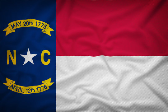 North Carolina flag on the fabric texture background,Vintage sty