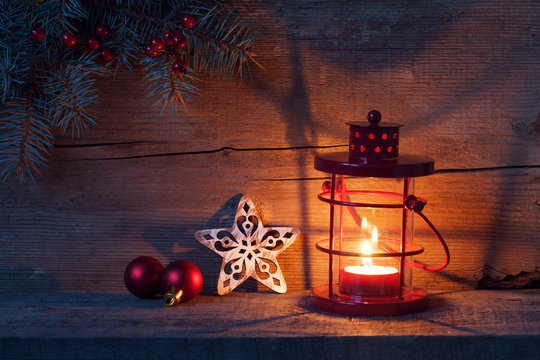 Christmas decorations and lantern in night on old wooden background. Stock  Photo | Adobe Stock