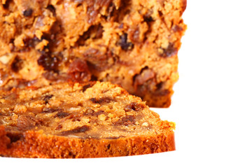 Fruit loaf cake.
Sliced fruit loaf cake isolated on white background.