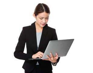 Asian businesswoman use of the notebook computer