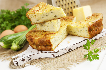 Zucchini pie with cheese and herbs