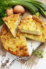 Zucchini pie with cheese and herbs