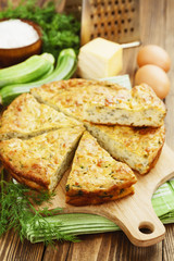 Zucchini pie with cheese and herbs