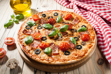 Home baked pizza with bacon and mushrooms