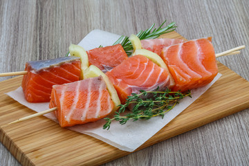 Raw salmon skewers