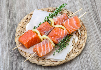 Raw salmon skewers