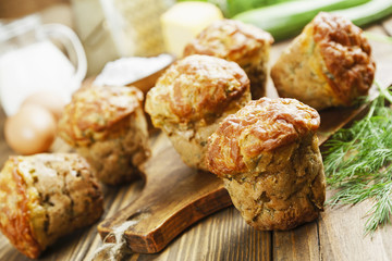 Muffins with zucchini, cheese and herbs