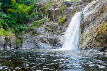 Waterfall in deep rain forest.