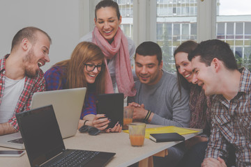 Young group of people discussing business plans.