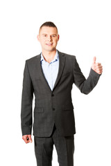 Young businessman gesturing ok sign