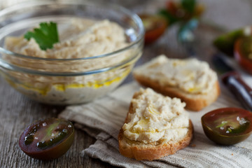Delicious snack from crostini with chicken pate or paste and tomatoes, selective focus
