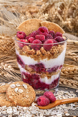 .healthy meal with fresh raspberries, cream and biscuits of rye