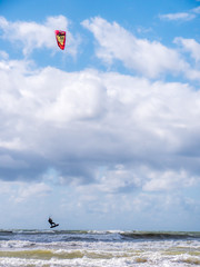 Wakeboarder making tricks on waves