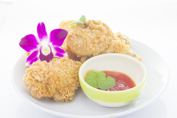 Fried chicken and decorative orchid