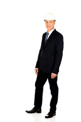 Smiling businessman with hard hat