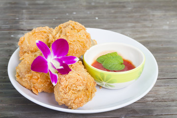 Fried chicken and decorative orchid