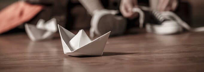 Paper toy on wooden floor