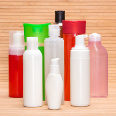 Different cosmetic products on wooden surface