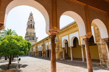 Bell tower and gardens of the Mosque Cathedral in Cordoba - obrazy, fototapety, plakaty