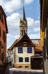 Very high belltower of cathedral in Dambach la Ville, France