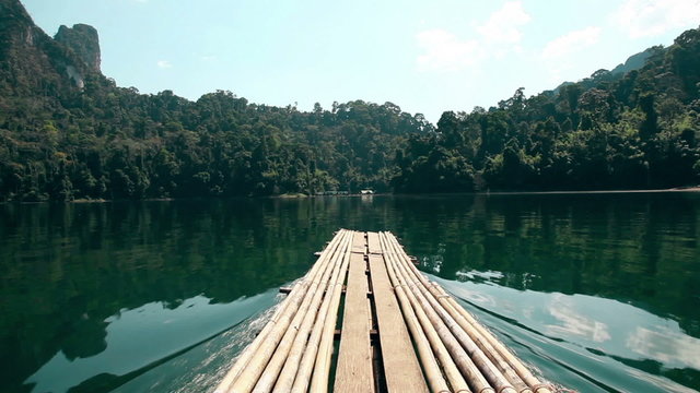Asia. Thailand. Khao Sok National Park. Sail Boat on the lake moving among high mountains rock. Asian nature. 