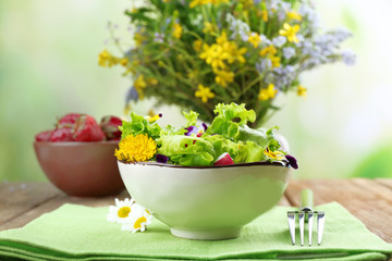 Light organic salad with flowers, close up