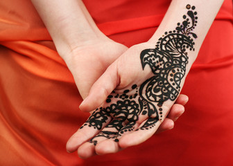 Image of henna on female hand, closeup